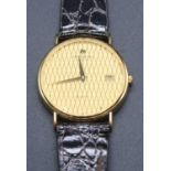 A vintage gent's Raymond Weil gold plated quartz wristwatch, with leather wallet and booklet