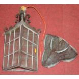 A Victorian triangular shaped glazed iron lantern, with a copper shade, converted for electricity,