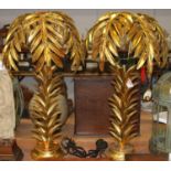 A pair of gilt table lamps with shades in the form of palm trees, h.72cm