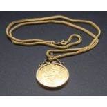 A modern 9ct gold zodiac pendant for Virgo, assayed London 1978, in 9ct gold mount and on further