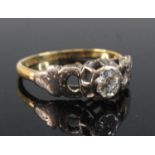 A yellow and white metal diamond solitaire ring, comprising an Old European cut diamond in an