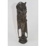 A Chinese carved hardwood and white metal inlaid figure of an elder, h.28cm