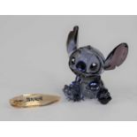 A Swarovski crystal Disney figure being Stitch with title plaque, height 8.5cmIn very good