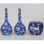 A pair of Chinese porcelain blue and white bottle vases, in the prunus pattern, h.21cm; together