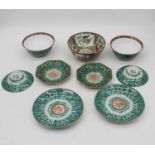 A collection of Chinese porcelain dinnerwares, each enamel decorated within insects amongst