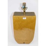 A yellow glazed pottery table lamp, of tapered slab-sided form, h.49cm (including fittings)