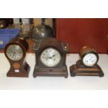 An Edwardian mahogany and inlaid balloon shaped mantel clock, the brushed steel dial showing Roman