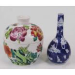 A Chinese porcelain bottle vase in the blue and white prunus pattern; together with a Chinese jar
