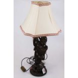 A Chinese carved hardwood figural table lamp and shade, height including shade 61cm