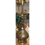 A Murano style table lamp, having a gilt speckled green glass body, with applied floral