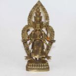 A gilt metal figure of Vishnu, shown standing before a pointed arch on a shaped base, h. 28cm