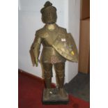 A metal model of a suit of armour on a rectangular wooden base, height 85cm