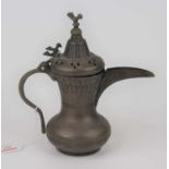 An Eastern copper coffee pot, with incised decoration