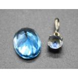 A loose oval cut blue sapphire, measuring approx 13.5 x 10.5 x 7.5mm; together with a round cut blue
