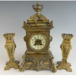 A late 19th century French cast and gilt brass three-piece clock garniture, comprising; clock of