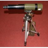 An Optolyth Ceralin German made telescope mounted on tripod stand, with leather case, length 48cm