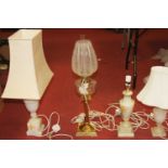 A Victorian oil lamp, having an etched frosted glass shade and moulded glass reservoir, brass column