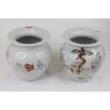 A pair of Chinese porcelain vases, of squat baluster form, having a flared rim, enamel decorated