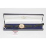 A gents Bucherer gold plated cased wrist watch, having a signed champagne dial with baton markers,