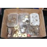 A box of assorted pocket and wrist watch parts to include dials, movements, etc