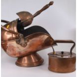 A Victorian copper coal scuttle of helmet shape, with shovel, together with a Victorian copper