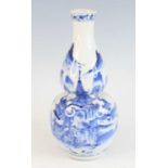 A Chinese Guangxu period (1871-1908) blue and white double gourd stoneware vase, underglaze