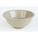 A Chinese Yuan Dynasty (1271-1368) provincial pale green/grey celadon footed bowl, undecorated and
