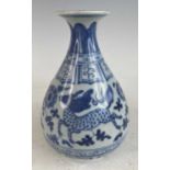 A Chinese blue and white stoneware vase in the Yuan shape, underglaze decorated with Qilin &