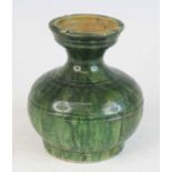 A Chinese Han Dynasty (202 BC-220 AD) green lead glazed pottery burial urn, with tapering neck to