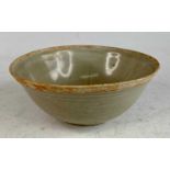 A Chinese Yuan Dynasty (1271-1368) pale grey celadon footed bowl, the centre of interior incise