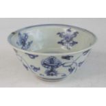 A Chinese Ming period (1368-1644) blue and white stoneware footed bowl, with slightly flaring rim,