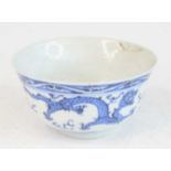 A 19th century Chinese porcelain blue and white footed rice bowl, the exterior underglaze