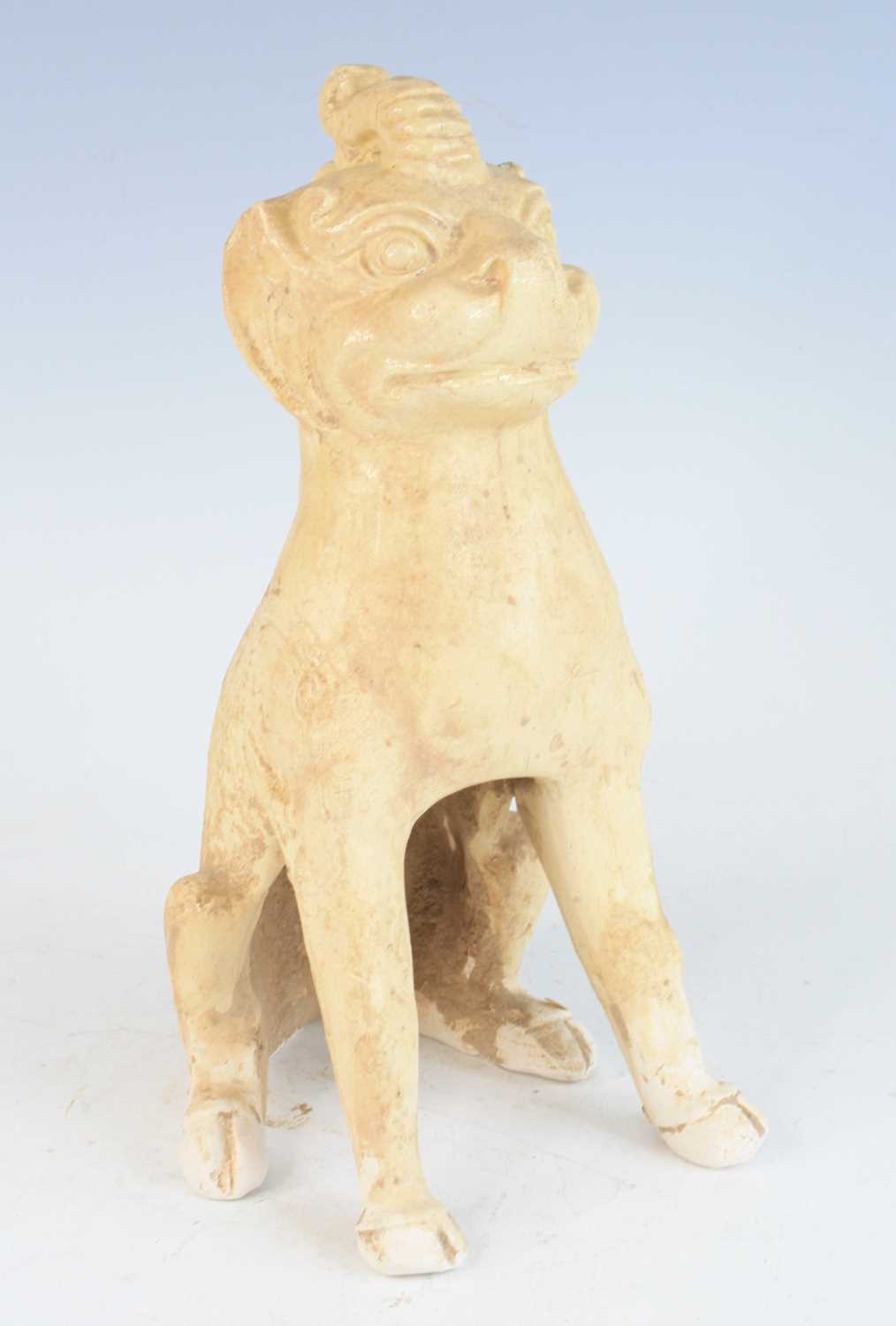 A Chinese Tang Dynasty (618-907) pottery grave figure of an earth spirit, white-straw glazed and