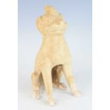 A Chinese Tang Dynasty (618-907) pottery grave figure of an earth spirit, white-straw glazed and