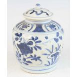 A Chinese late Ming period (1368-1644) Swatow blue and white stoneware funerary jar and cover, the