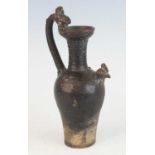 A Chinese probably Yuan Dynasty (1271-1368) single handled ewer, with dragon head terminal handle,