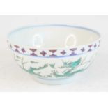 A Chinese porcelain footed dragon bowl, the interior and exterior decorated with five-clawed beasts,