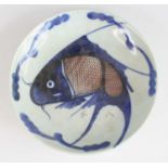 A Chinese 19th century provincial pottery dish, of shallow circular form, underglaze painted with