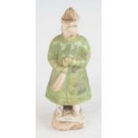 A Chinese late Ming period (1368-1644) earthenware tomb figure of a standing soldier, painted in