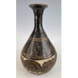 A Chinese Yuan Dynasty (1271-1368) pottery vase, painted in tones of dark brown, with incised
