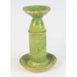 A Chinese green glazed pottery domestic ware oil lamp, probably 18th century, having waisted upper