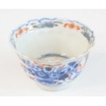 A Chinese late Kangxi period (1662-1722) small footed porcelain cup, with slightly shaped upper