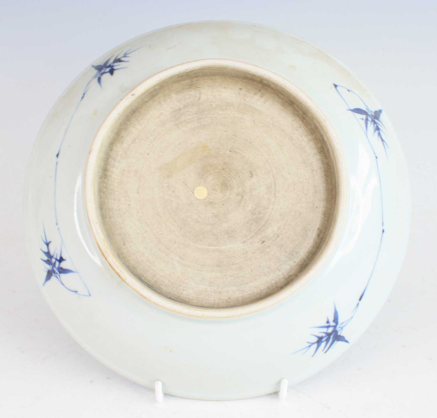 A large Chinese 19th century blue and white stoneware dish, of shallow circular footed form, - Image 3 of 4