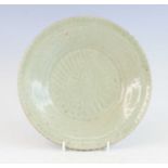 A Chinese late Ming Dynasty (1368-1644) Longquan celadon platter, having a scallop edge and of