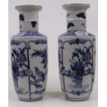 A pair of Chinese blue and white porcelain vases, of shouldered cylindrical form, having a flared