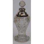 A silver mounted cut glass scent jar and stopper, of baluster form, on a circular foot (hallmarks