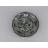 A Chinese blue & white pottery dish, underglaze decorated with a bird amongst flowers, bearing a