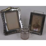 An Edwardian silver clad easel photograph frame, Chester 1908, 16x11cm, together with another, and a