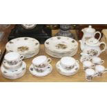 A Royal Worcester four-place setting coffee, dinner and tea service, decorated with leaves and