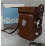 A Rolleiflex compact ciné camera, in a brown faux leather caseNo apparent serial number to top of